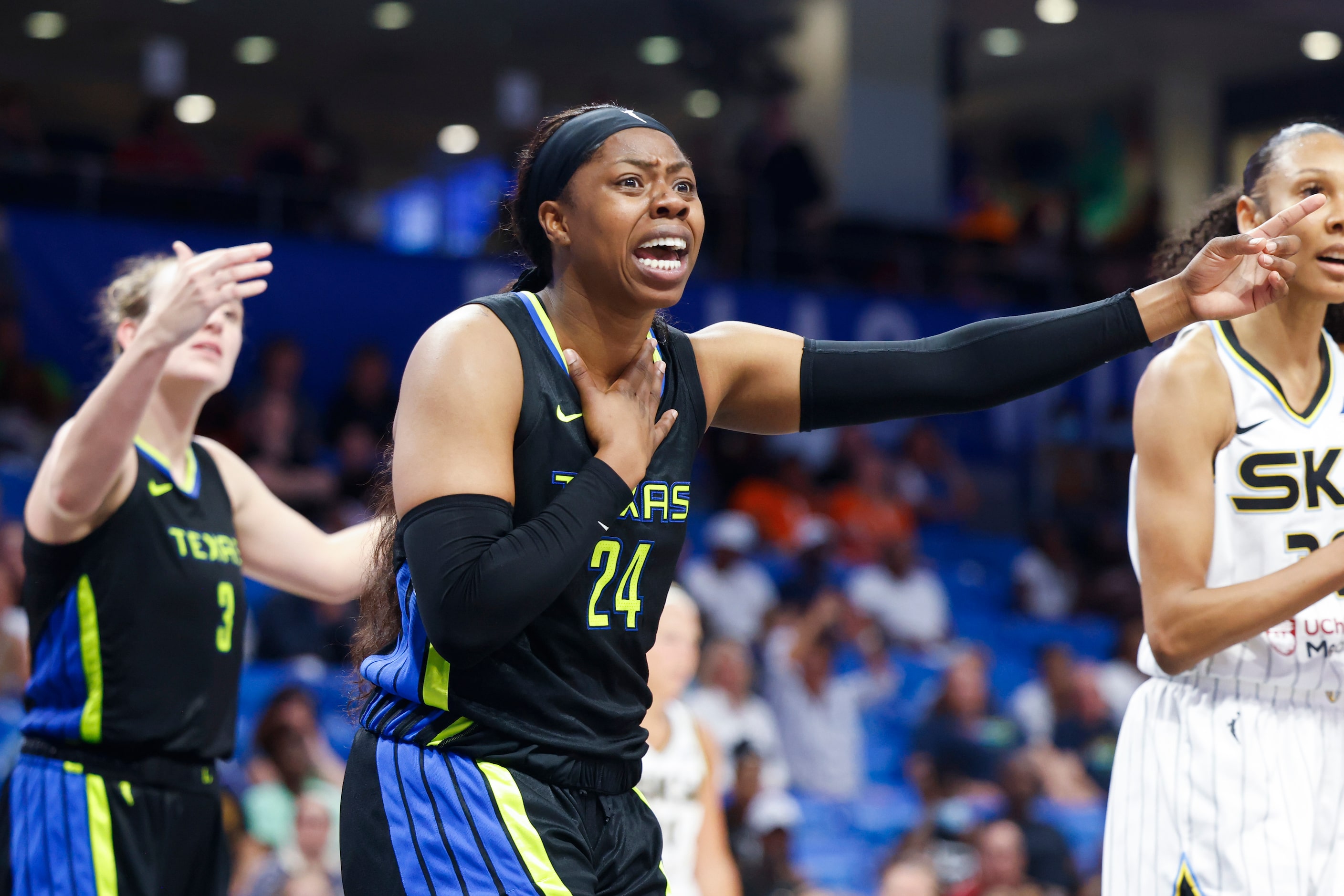 Dallas Wings guard Arike Ogunbowale reacts after being fouled by Chicago Sky during the...