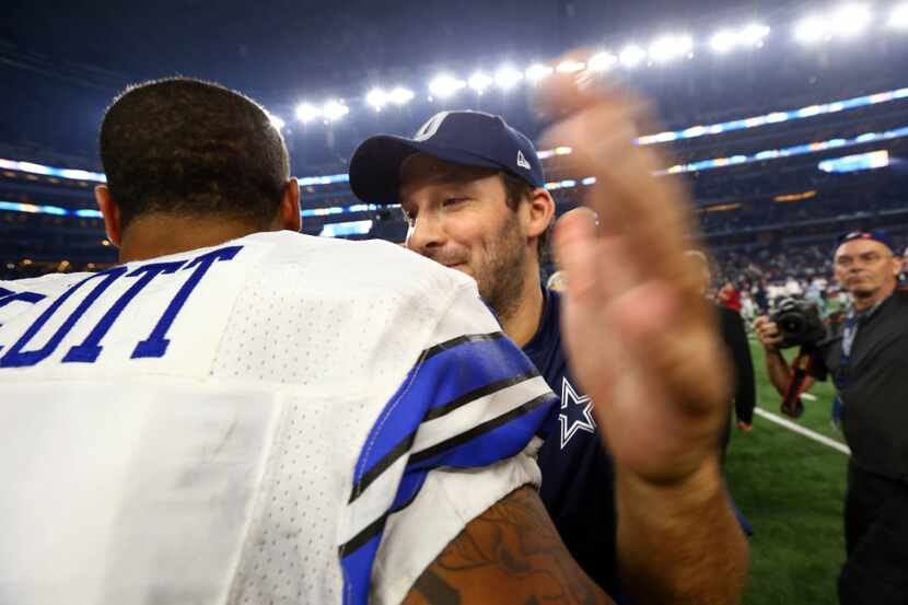 ARLINGTON, TX - SEPTEMBER 25:  Dak Prescott #4 of the Dallas Cowboys hugs Tony Romo after a...