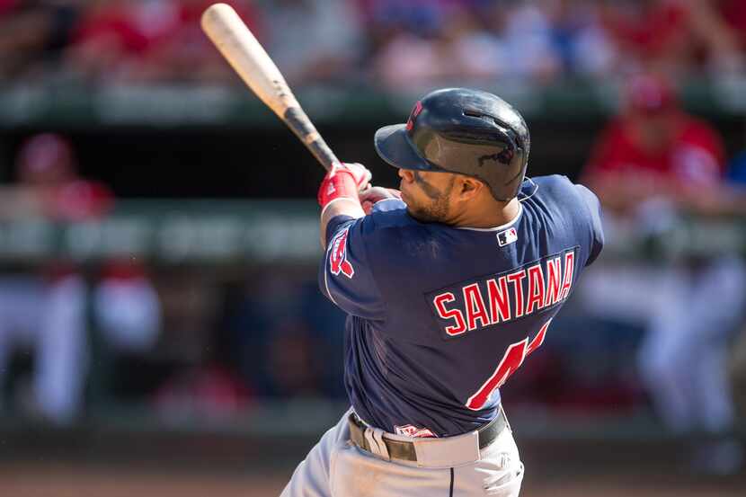 Jun 7, 2014; Arlington, TX, USA; Cleveland Indians third baseman Carlos Santana (41) hits a...