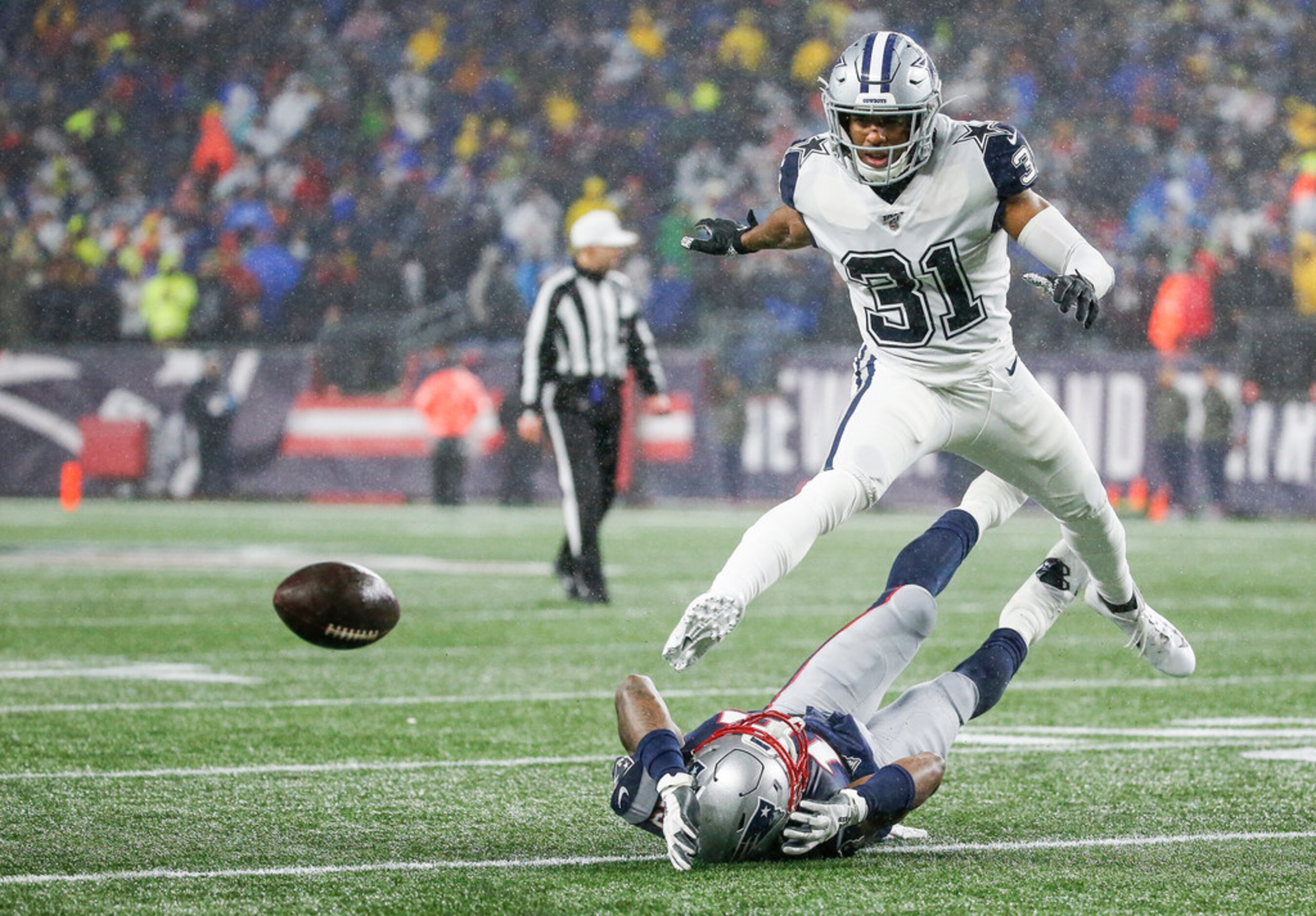 Dallas Cowboys cornerback Byron Jones (31) breaks up a pass intended for New England...