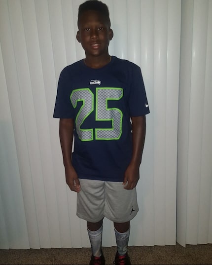 Texas linebacker Anthony Hill Jr., pictured here as a child, grew up a Seattle Seahawks fan...