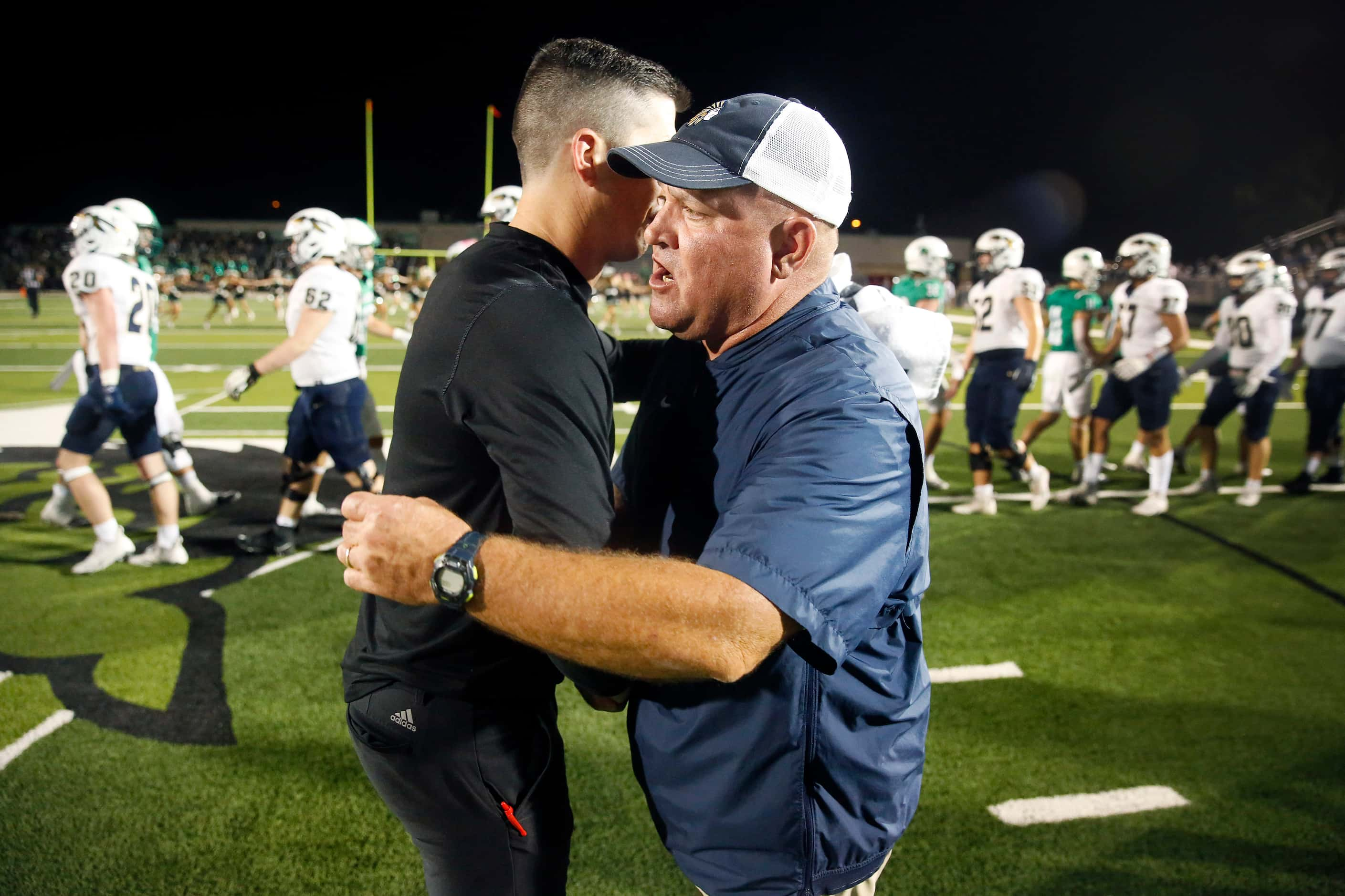 Southlake Carroll head coach Riley Dodge (left) and Keller head football coach Carl Stralow...