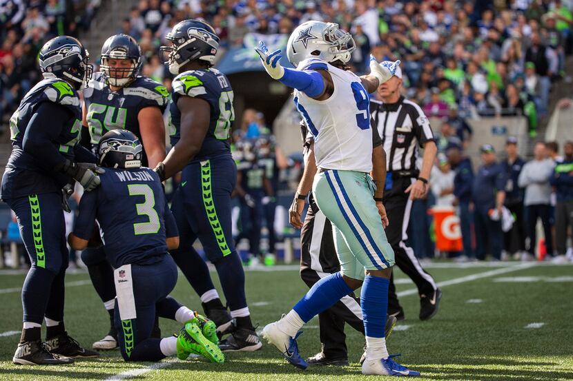 Dallas Cowboys defensive end Demarcus Lawrence (90) celebrates after sacking Seattle...