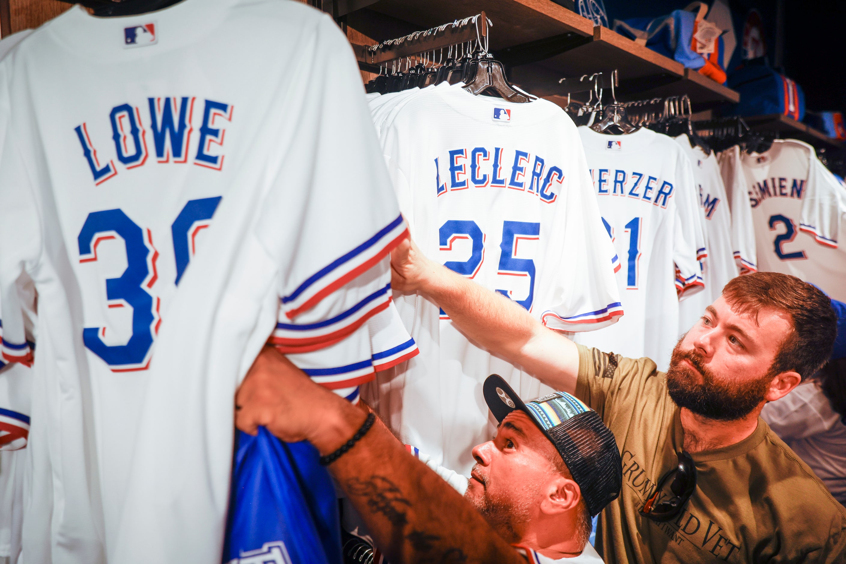 Fans shop inside the Grand Slam Team Store ahead of Game 1 of the World Series between Texas...