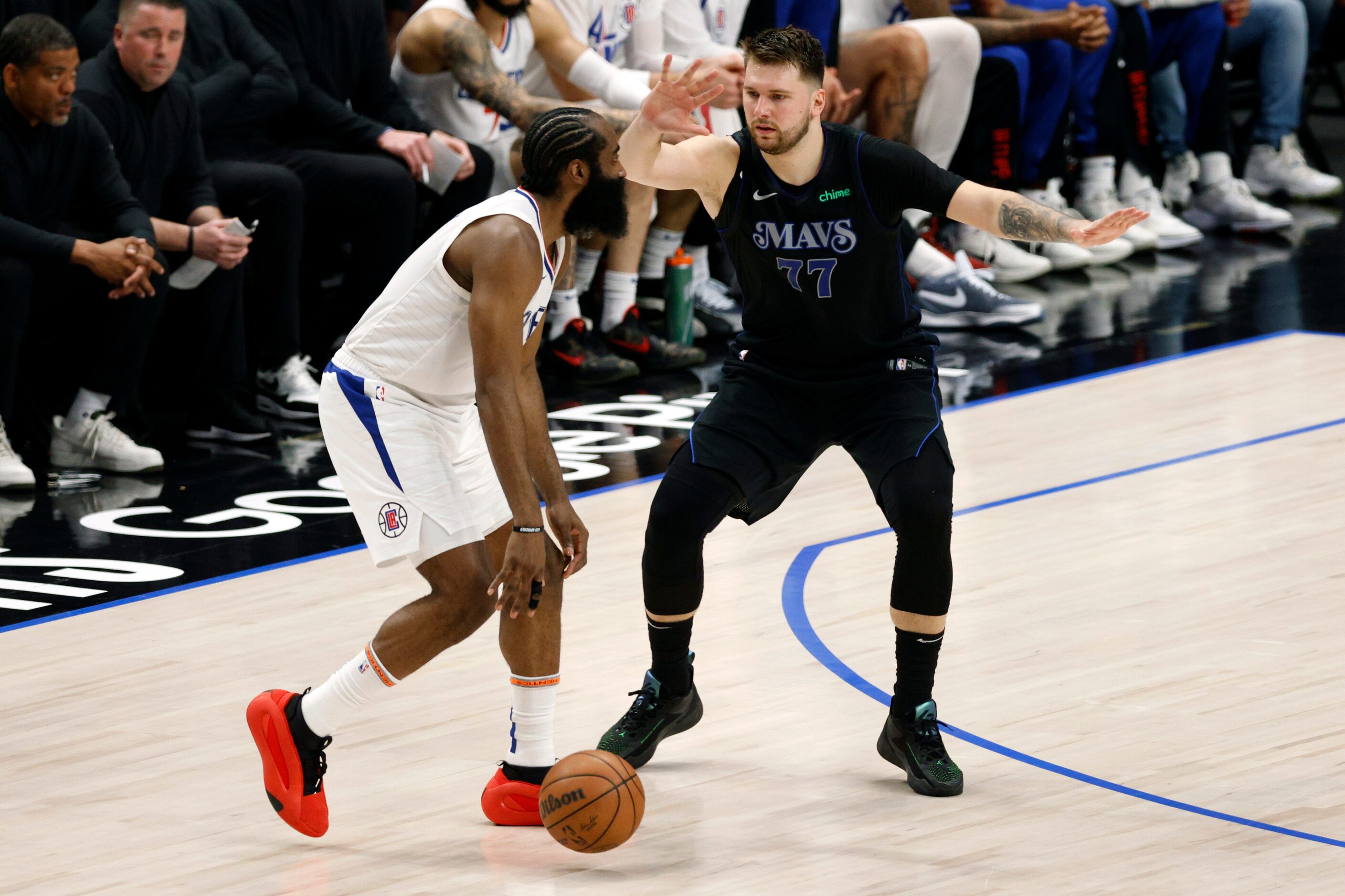 Dallas Mavericks guard Luka Doncic (77) defends LA Clippers guard James Harden (1) during...