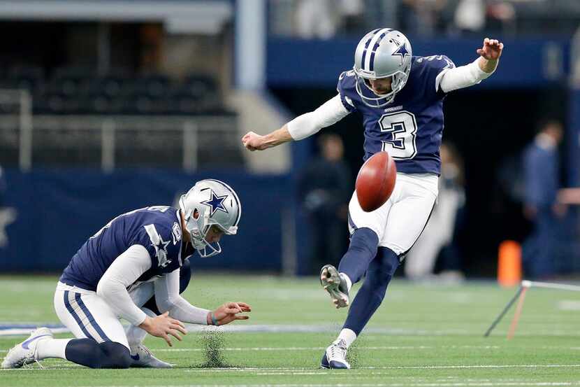 Dallas Cowboys kicker Kai Forbath (3) practices his kicks during pregame warmups at AT&T...