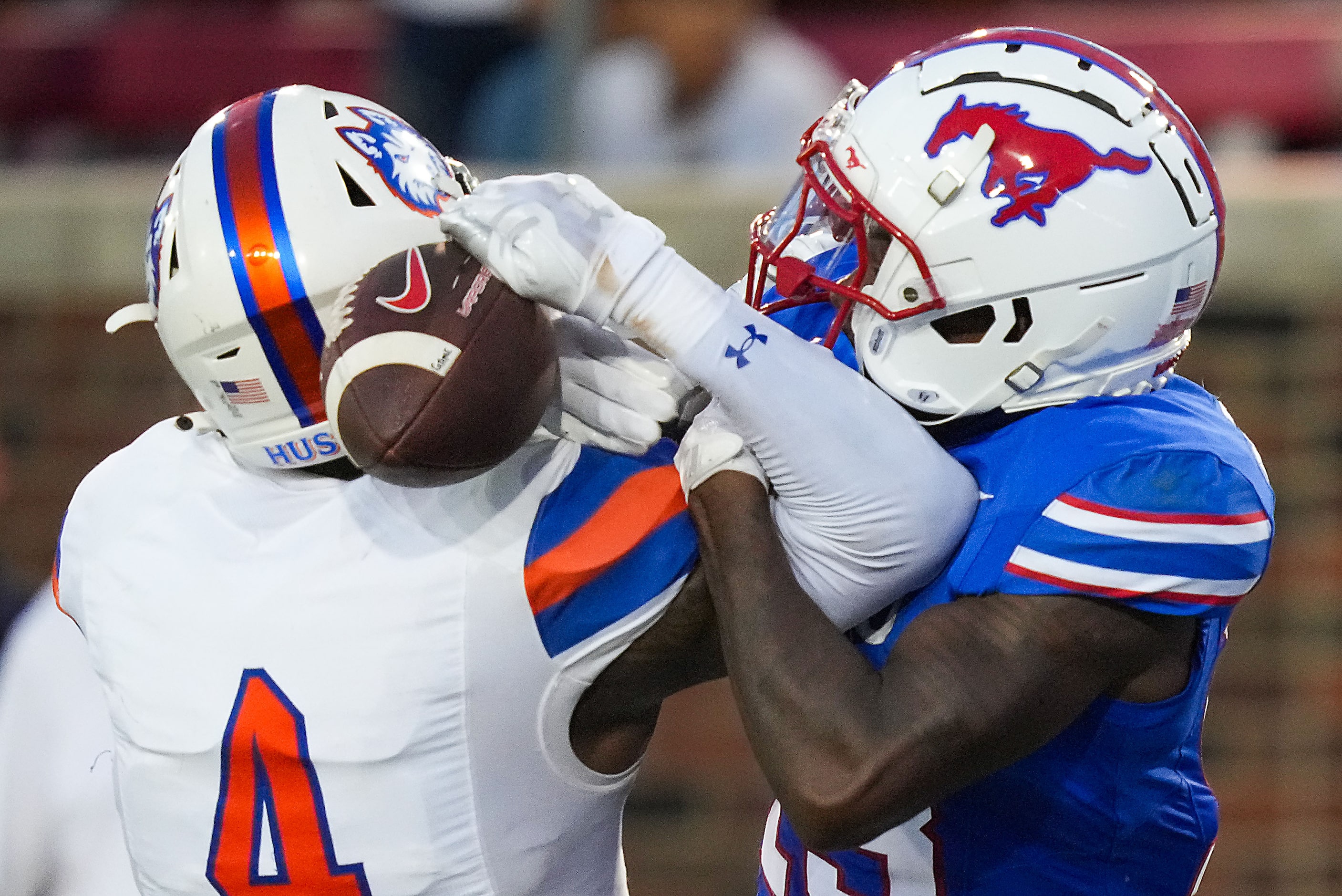 Houston Christian cornerback Ashton Williams (4) breaks up a pass intended for SMU wide...