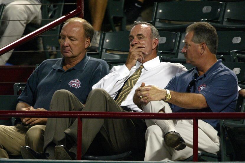 Texas Rangers owner Tom Hicks (left) general manager John Hart (center) and Grady Fuson...