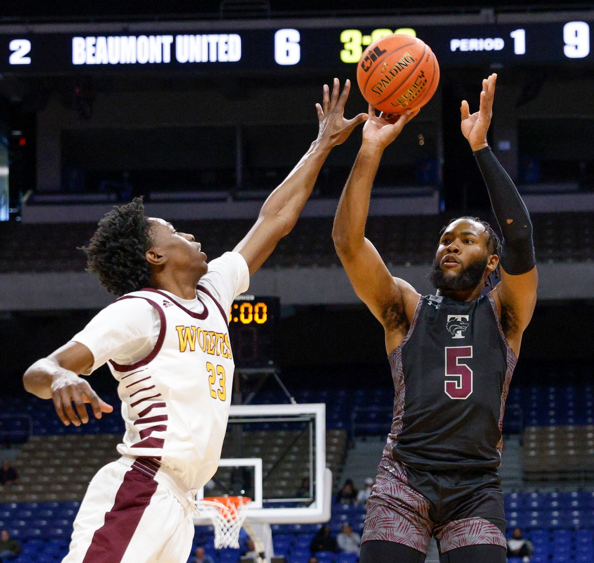 Mansfield Timberview guard Jared Washington (5) launches a shot over Beaumont United forward...