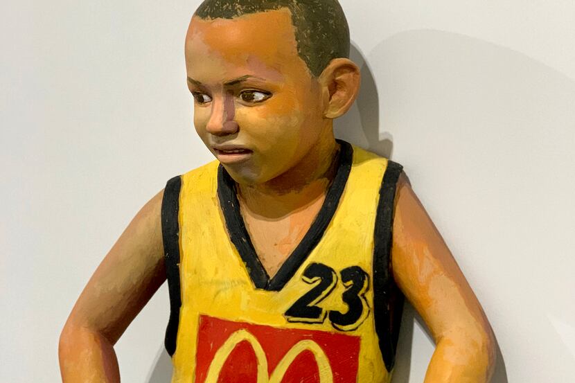 John Ahearn's "Jhovan" depicts a young basketball player.