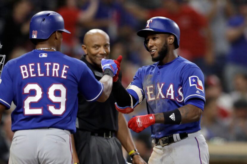 Profar (izq.) y Beltré. (AP Photo/Gregory Bull)