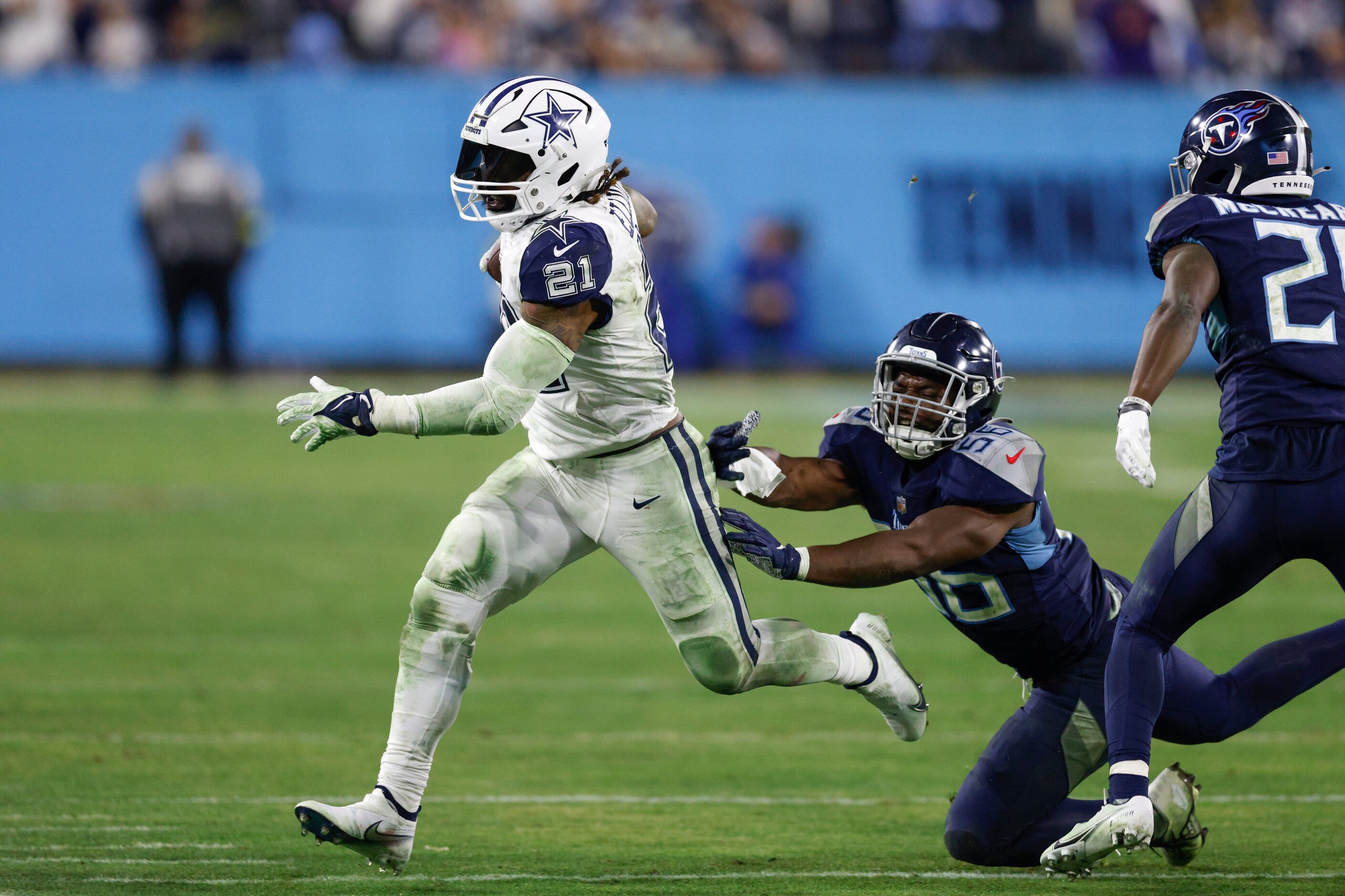 Tennessee Titans linebacker Monty Rice (56) forces Dallas Cowboys running back Ezekiel...