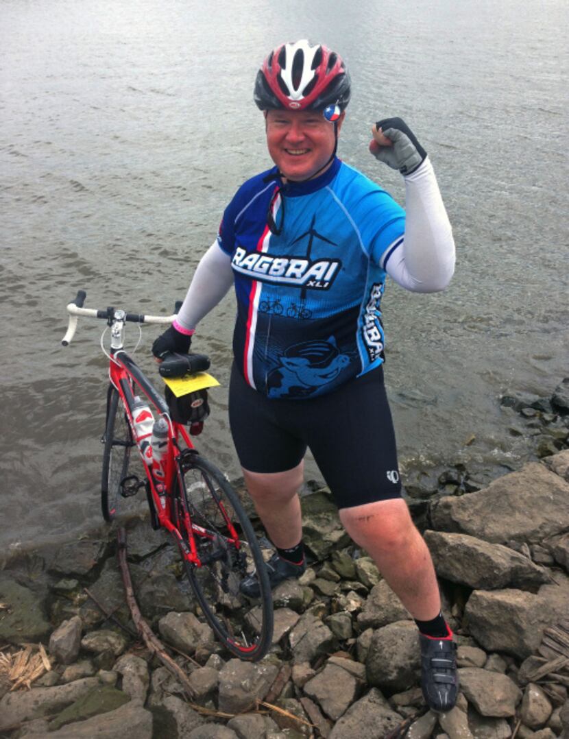 Dallas senior assistant attorney Don Knight, placed his front tire in the Mississippi River...