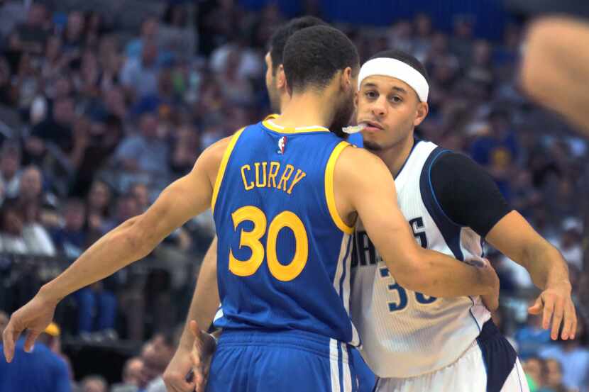 Golden State Warriors guard Stephen Curry (30) and Dallas Mavericks guard Seth Curry (30)...
