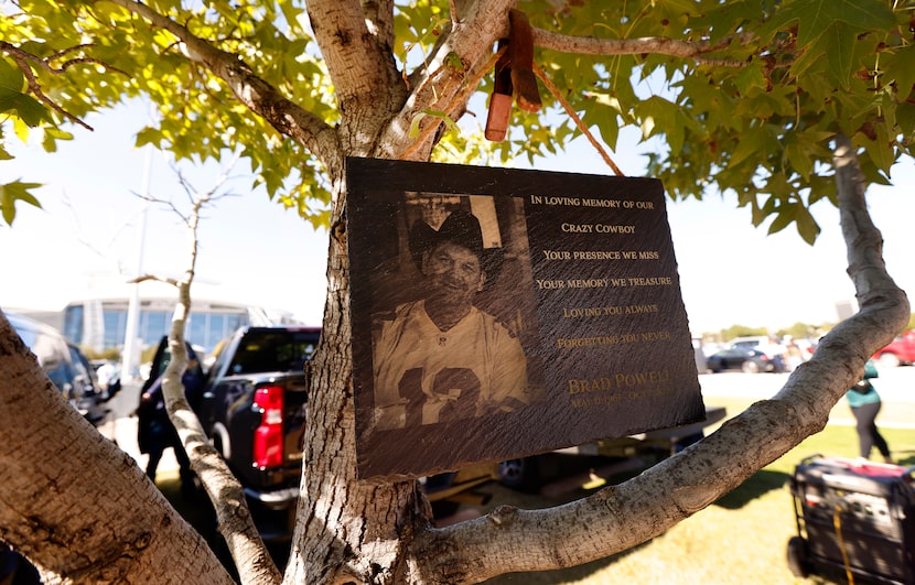 A memorial honoring Brad Powell hangs in a tree during a Lot 4 Gate 6 Tailgaters party...