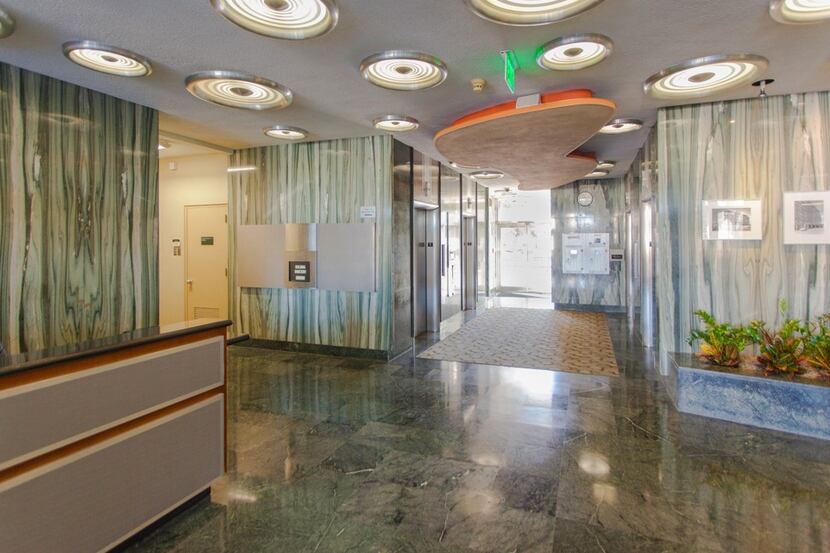  The Meadows Building lobby has green polished stone and "bubble" lights in the ceiling....