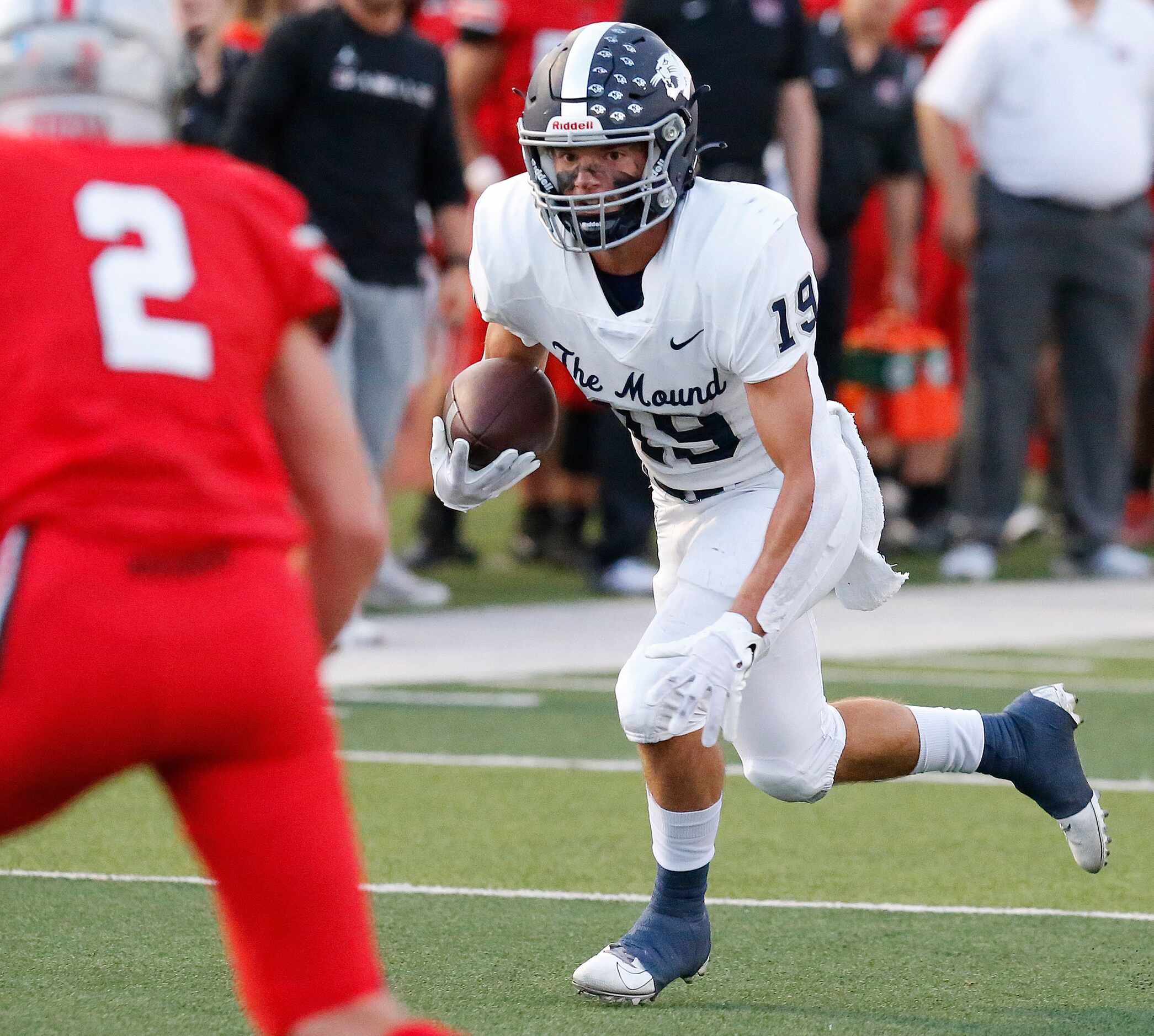 Flower Mound High School wide receiver Cade Edlein (19) gets yardage after the catch during...