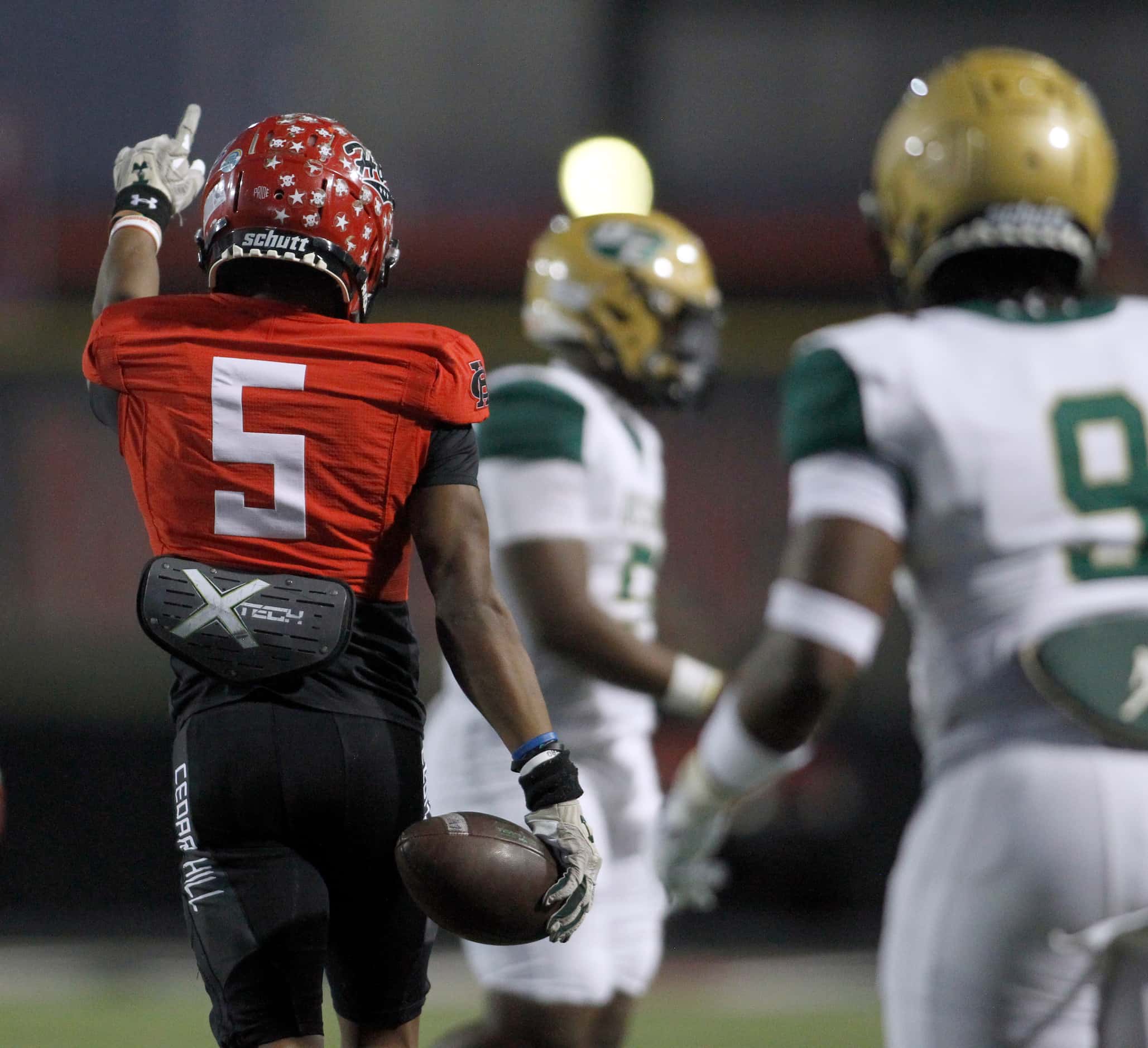Cedar Hill receiver A'vondric Rutherford (5) gestures change of possession after recovering...