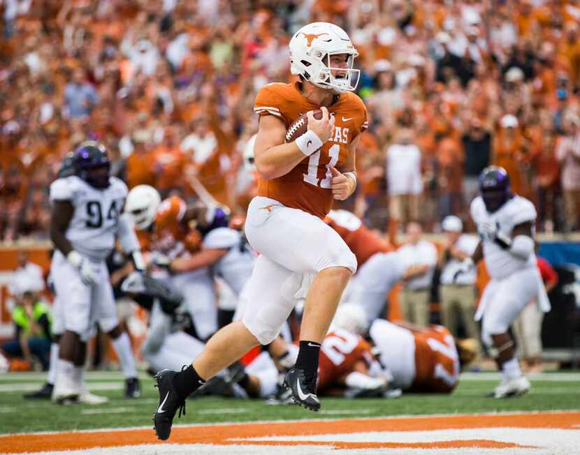 Texas Longhorns quarterback Sam Ehlinger (11) runs to the end zone for a touchdown during...