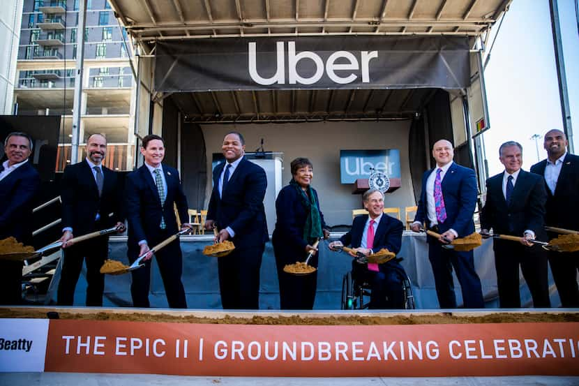 Uber CEO Dara Khosrowshahi (second from left), Dallas Mayor Eric Johnson (fourth from left),...