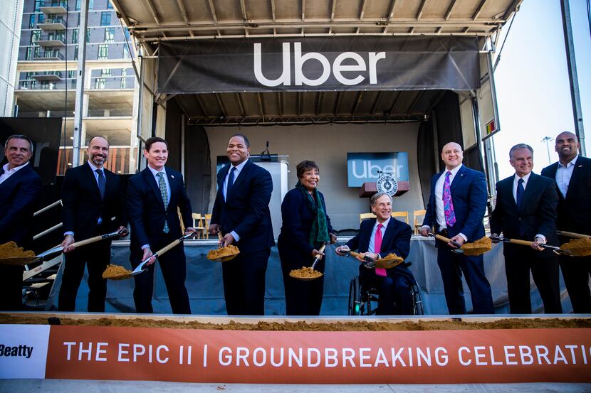 Uber CEO Dara Khosrowshahi (second from left), Dallas Mayor Eric Johnson (fourth from left),...