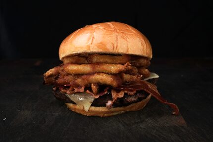 The barbecue bacon burger at AT&T Stadium is a 10-ounce beef patty topped with pepper jack...