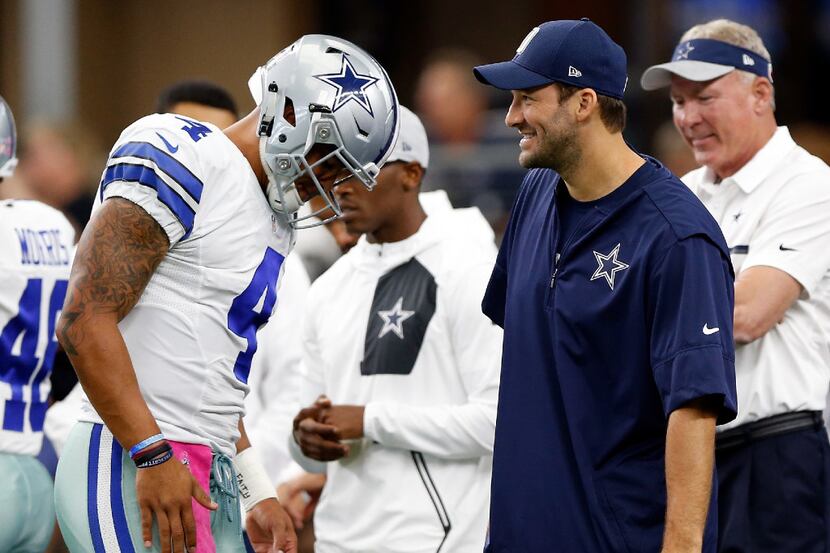 ARLINGTON, TX - OCTOBER 09:   (L-R) Dak Prescott #4, quarterback of the Dallas Cowboys talks...