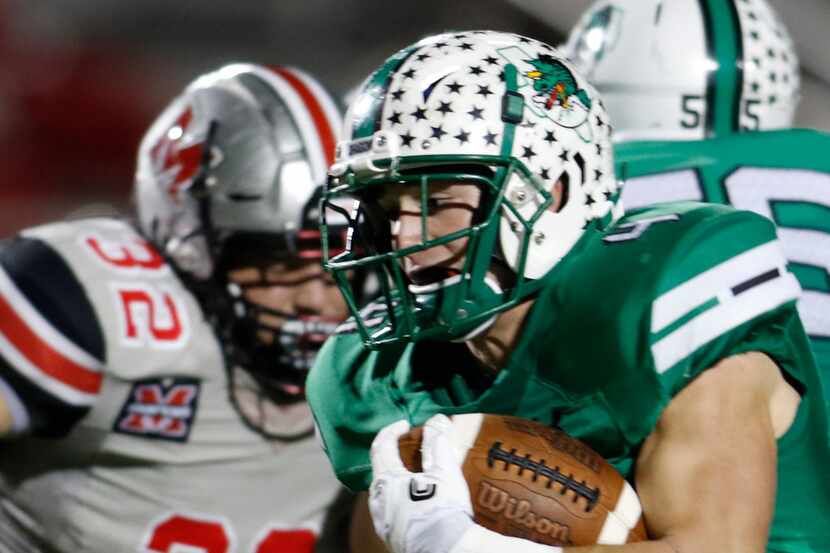 Southlake Carroll running back T.J. McDaniel (4) is "off to the races" as he scampers past...