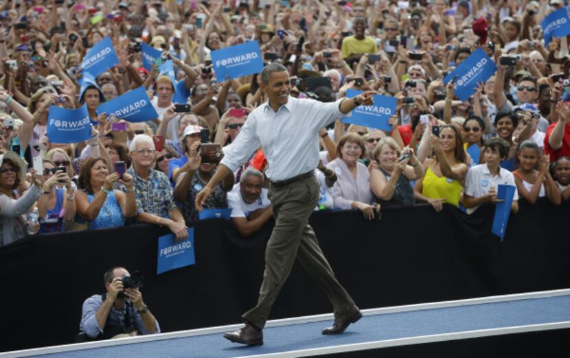 President Barack Obama walked on stage Saturday as he was introduced at a campaign rally at...