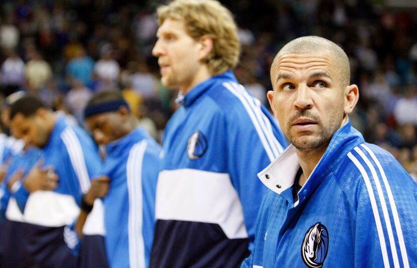Dallas Mavericks' Jason Kidd, right, looks around before their NBA basketball game with the...