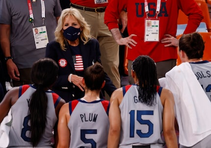 First lady Jill Biden talks with USA’s Jacquelyn Young (8), Kelsey Plum (5), Allisha Gray...