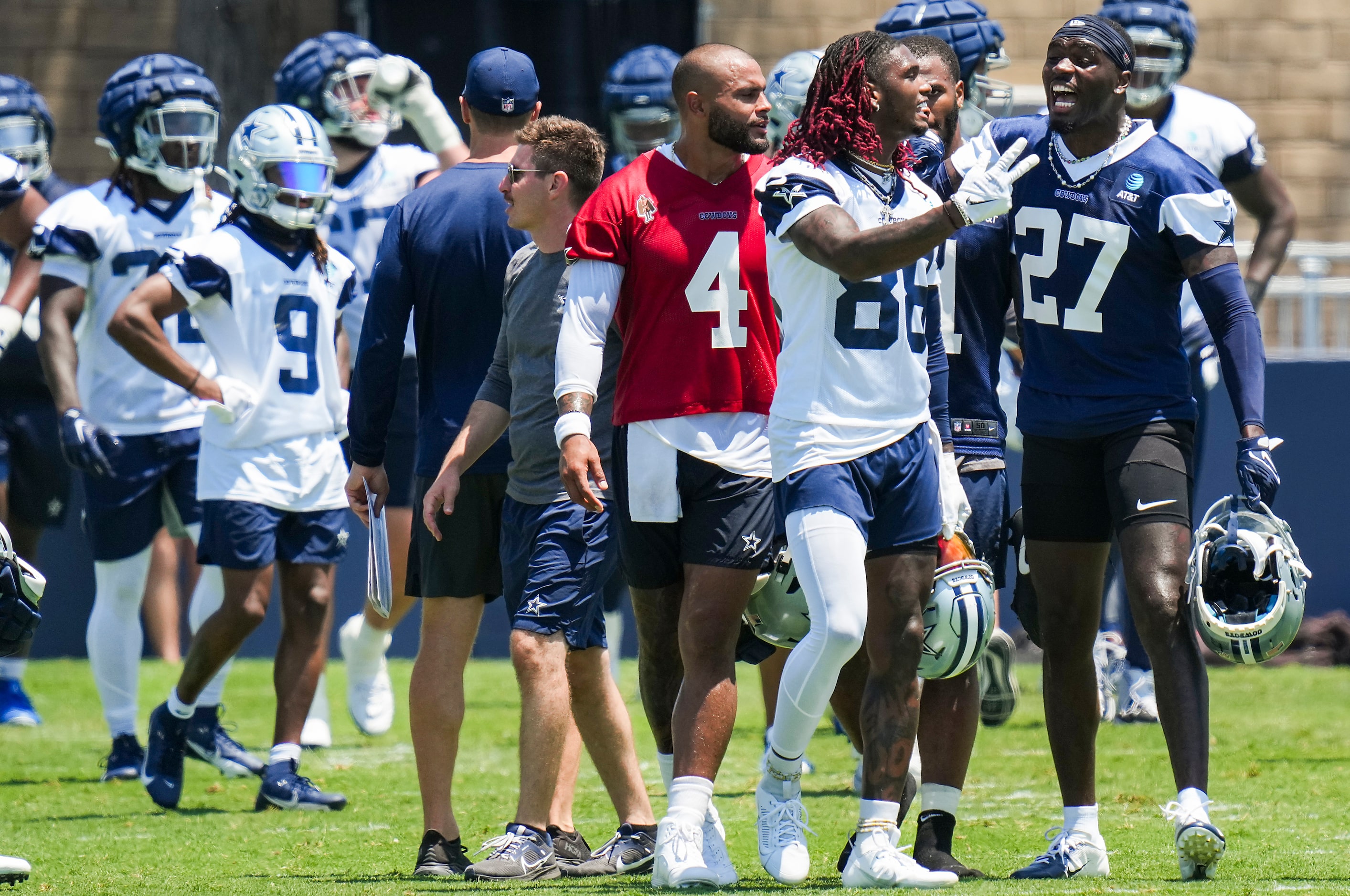 Dallas Cowboys safety Jayron Kearse (27) interacts with wide receiver CeeDee Lamb (88) and...