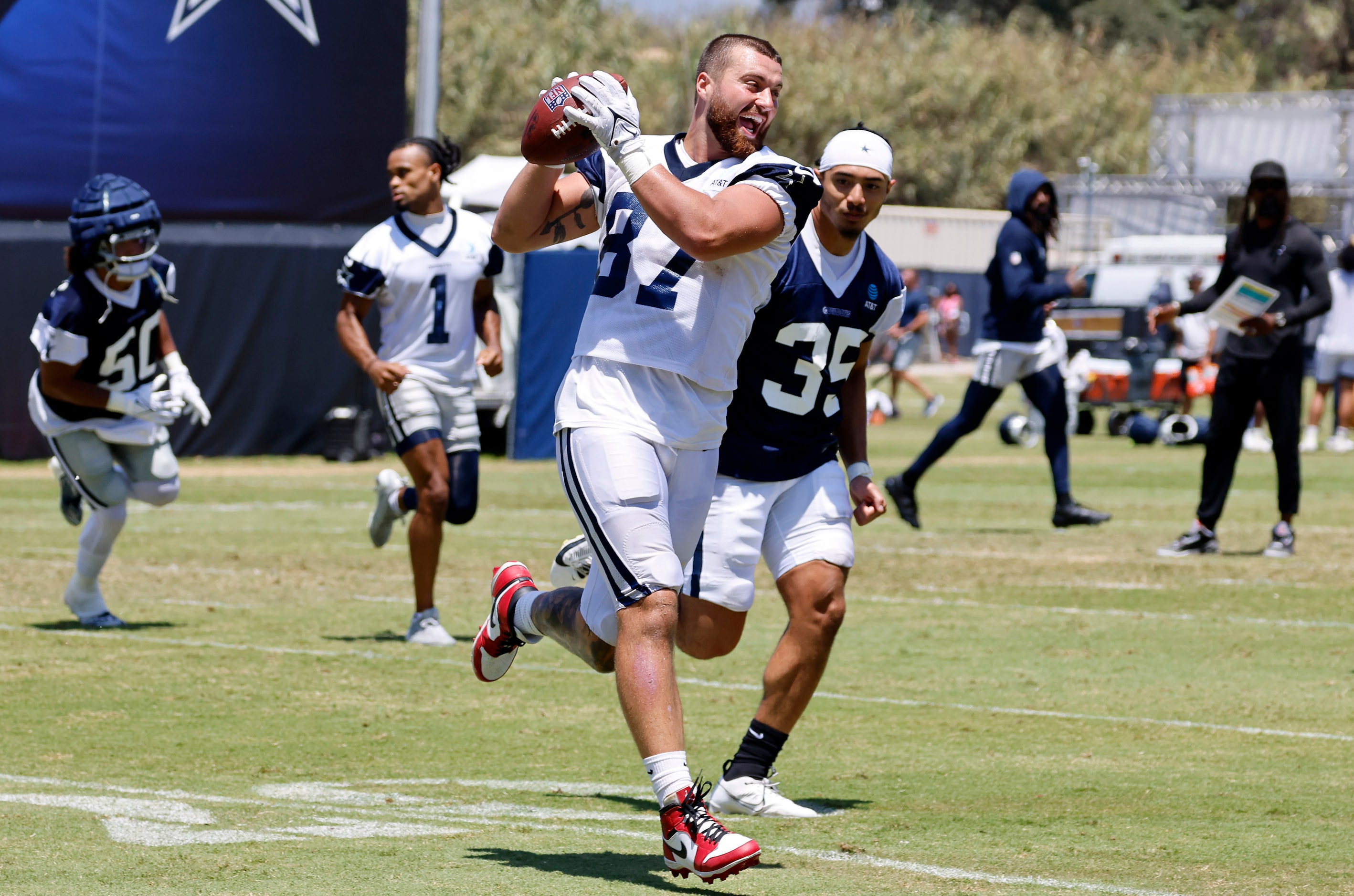 Dallas Cowboys tight end Jake Ferguson (87) catches a soft pass as the team ran plays...