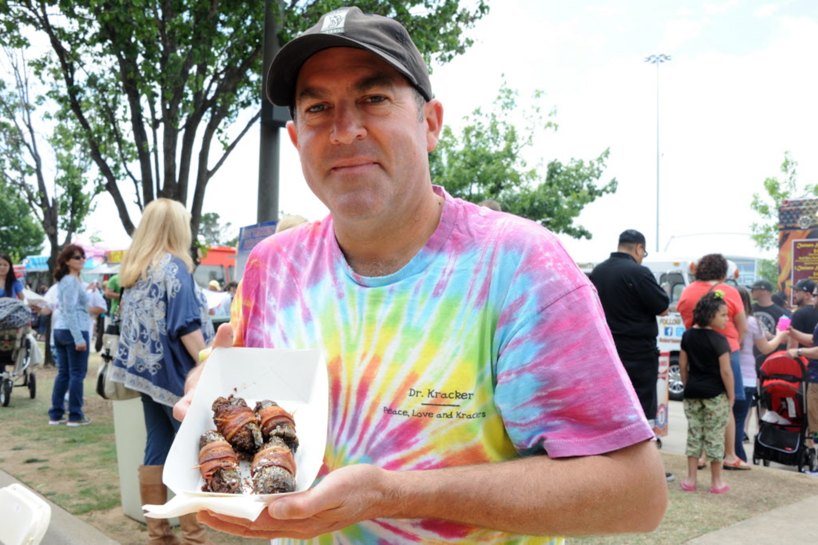 David Price orders Jalapenos wrapped with bacon from Yellow Belly food truck at the Food...