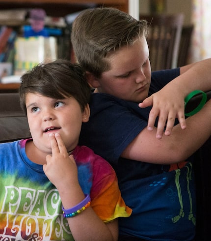 Marilyn Morrison, 9, makes a face alongside her playful brother Miles, 10.