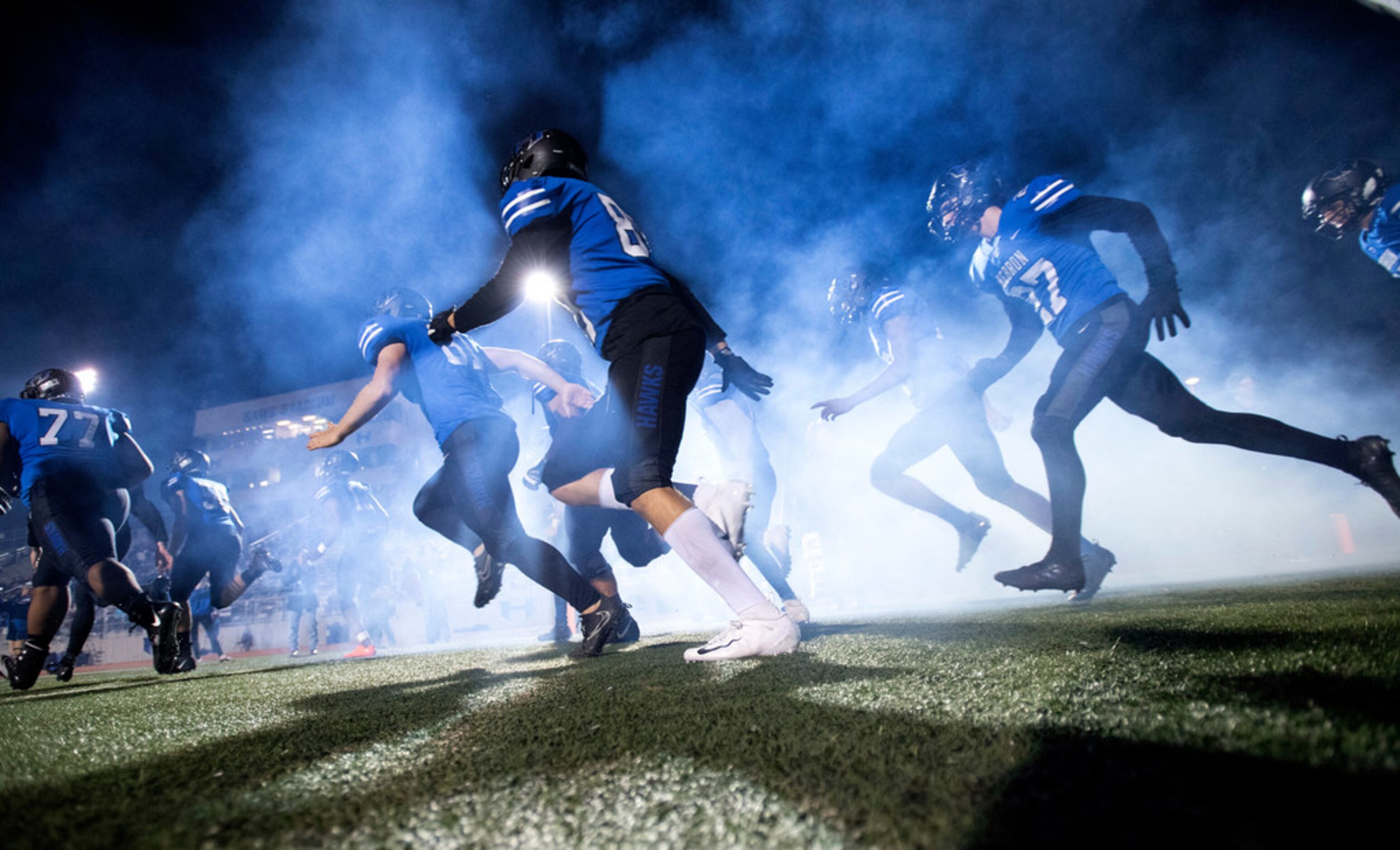 Hebron takes the field before a high school football game against Irving Friday, November 9,...