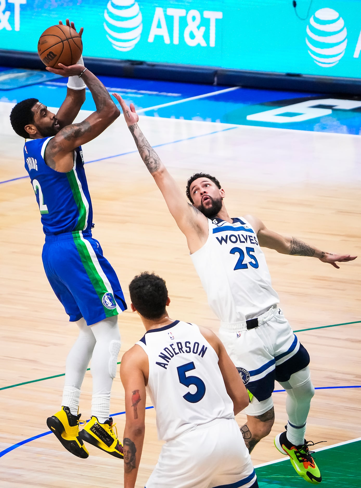 Dallas Mavericks guard Kyrie Irving (2) shoots over Minnesota Timberwolves guard Austin...