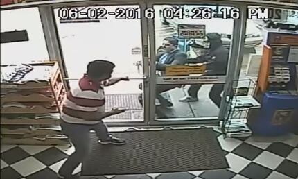Surveillance footage from inside a convenience store on June 2, 2016, showed the salesman...