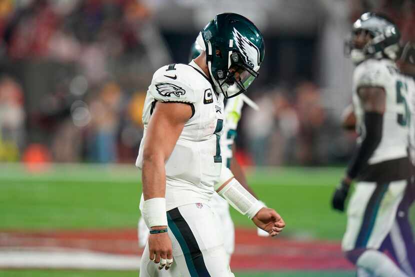 Philadelphia Eagles quarterback Jalen Hurts hangs his head after turning the ball over on...