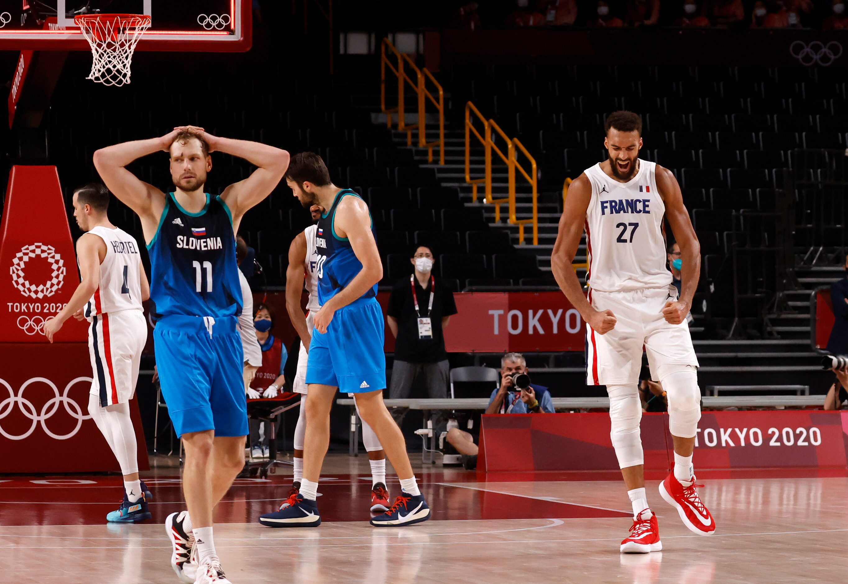 France’s Rudy Gobert (27) celebrates after they defeated Slovenia in the final seconds of a...