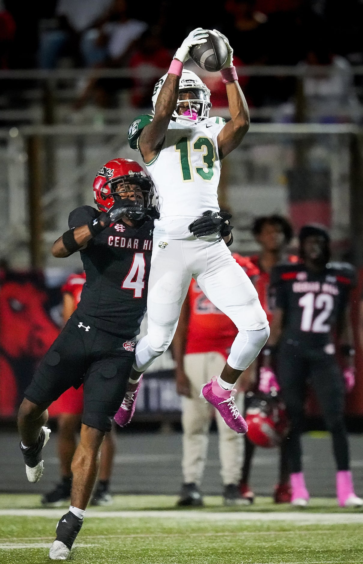 DeSoto wide receiver Daylon Singleton (13) makes a leaping catch against Cedar Hill...