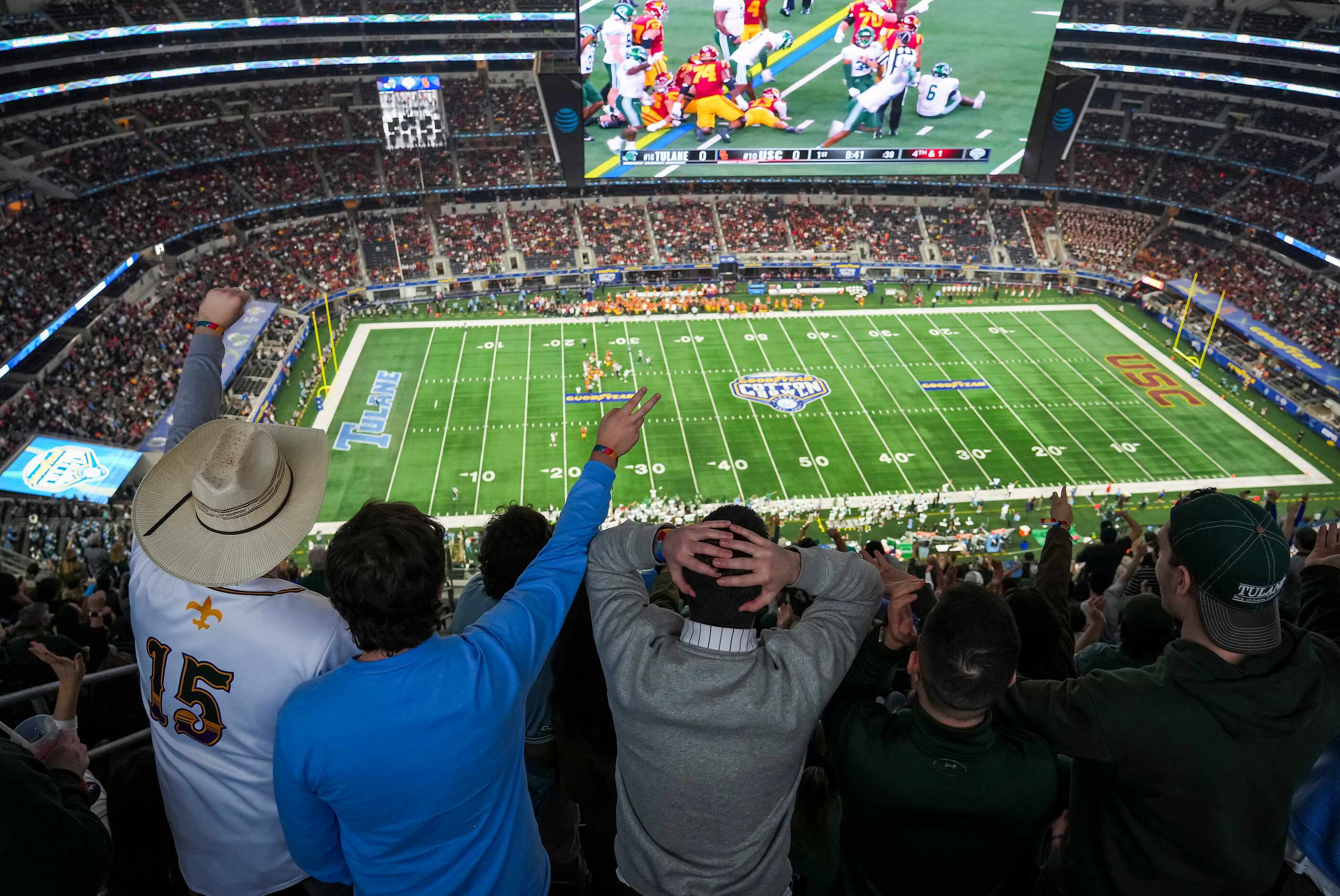 Tulane fans react after USC picked up a first down on a 4th down play during the first half...