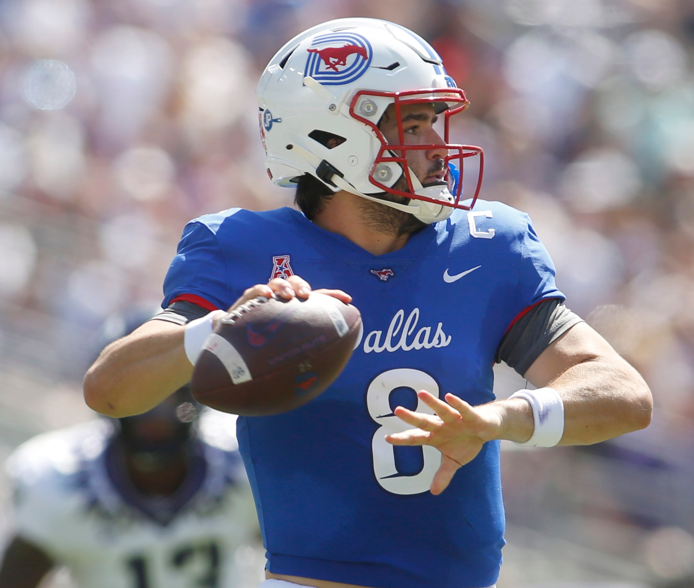 SMU quarterback Tanner Mordecai (8) looks to pass during the second quarter of play against...