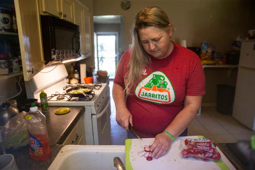 Elise Earnhart Bigony prepares radishes to cook with cactus at her home on May 18, 2020, in...