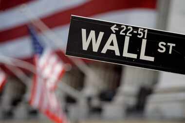 FILE - A midday gain for stocks Thursday on the heels of a four-week rally has turned the...