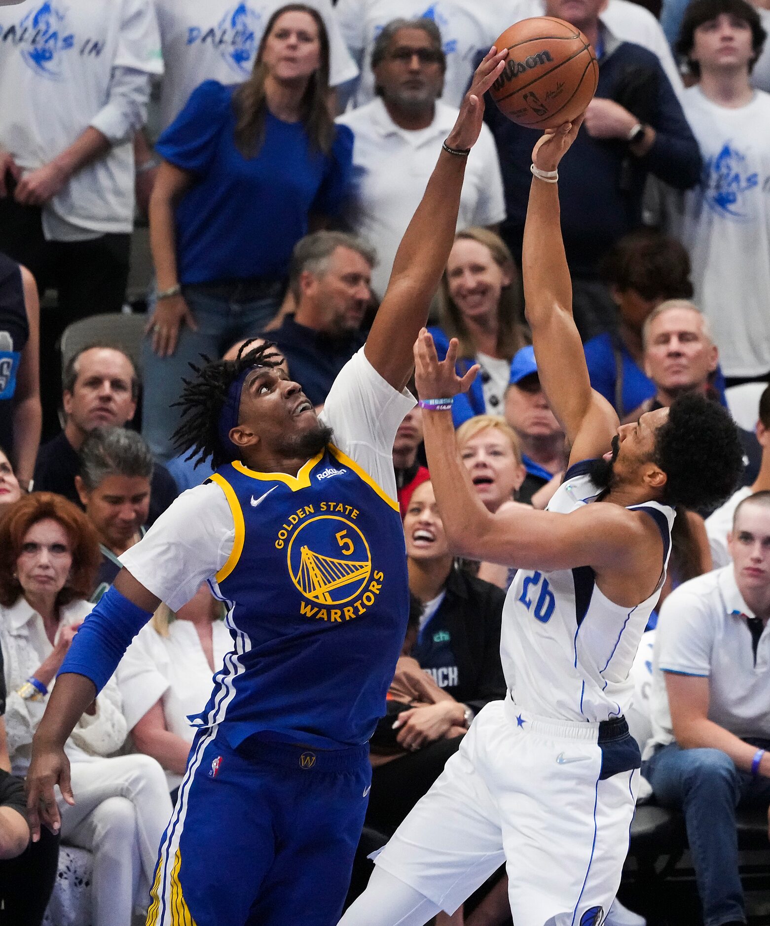 Golden State Warriors center Kevon Looney (5) blocks a shot by Dallas Mavericks guard...