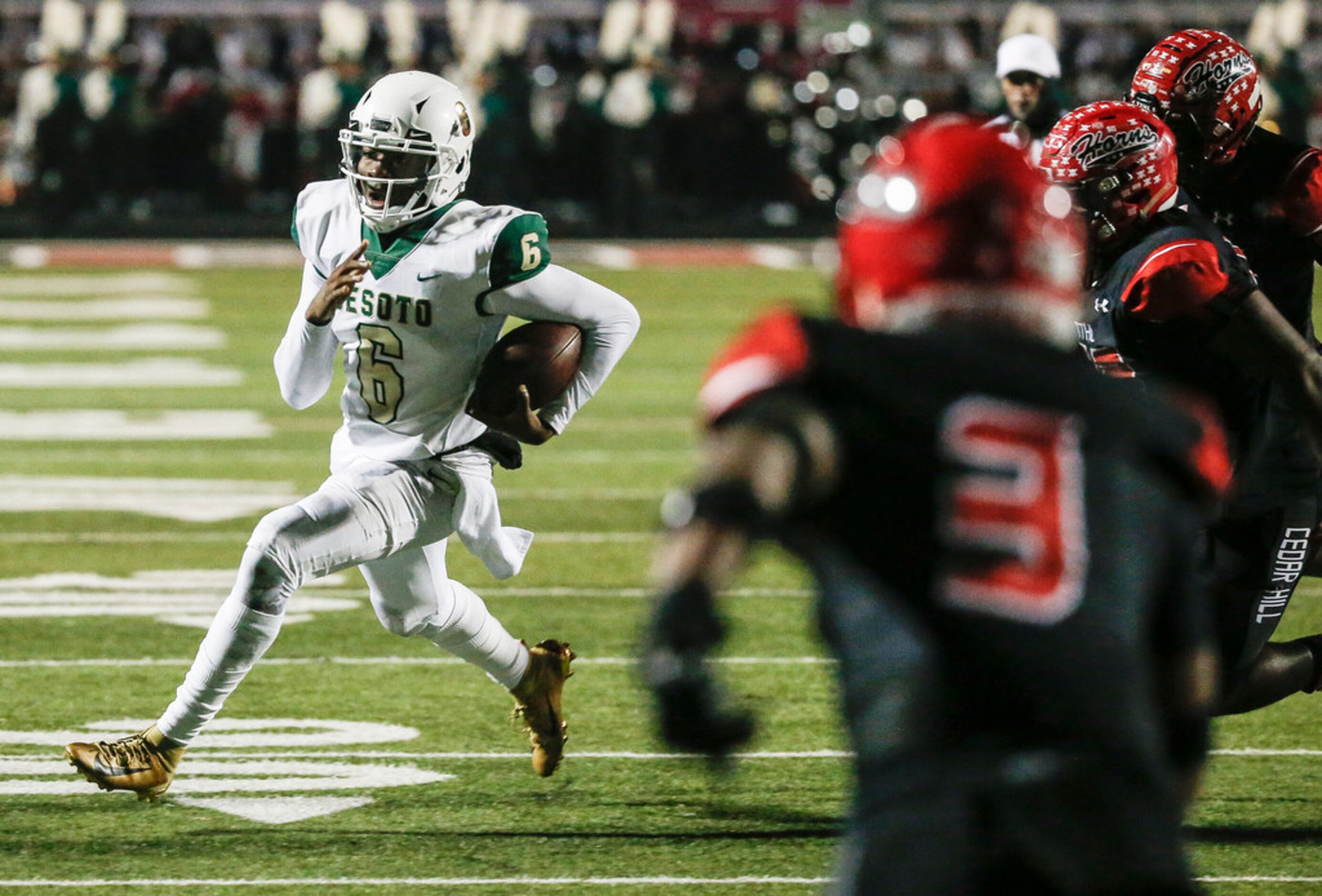 DeSoto Samari Collier (6) makes a break during a high school football match up between Cedar...