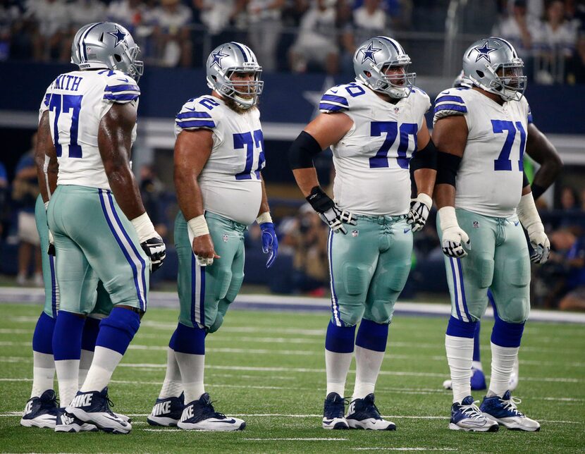 FILE - In this Sept. 10, 2017, file photo, Dallas Cowboys offensive tackle Tyron Smith (77),...