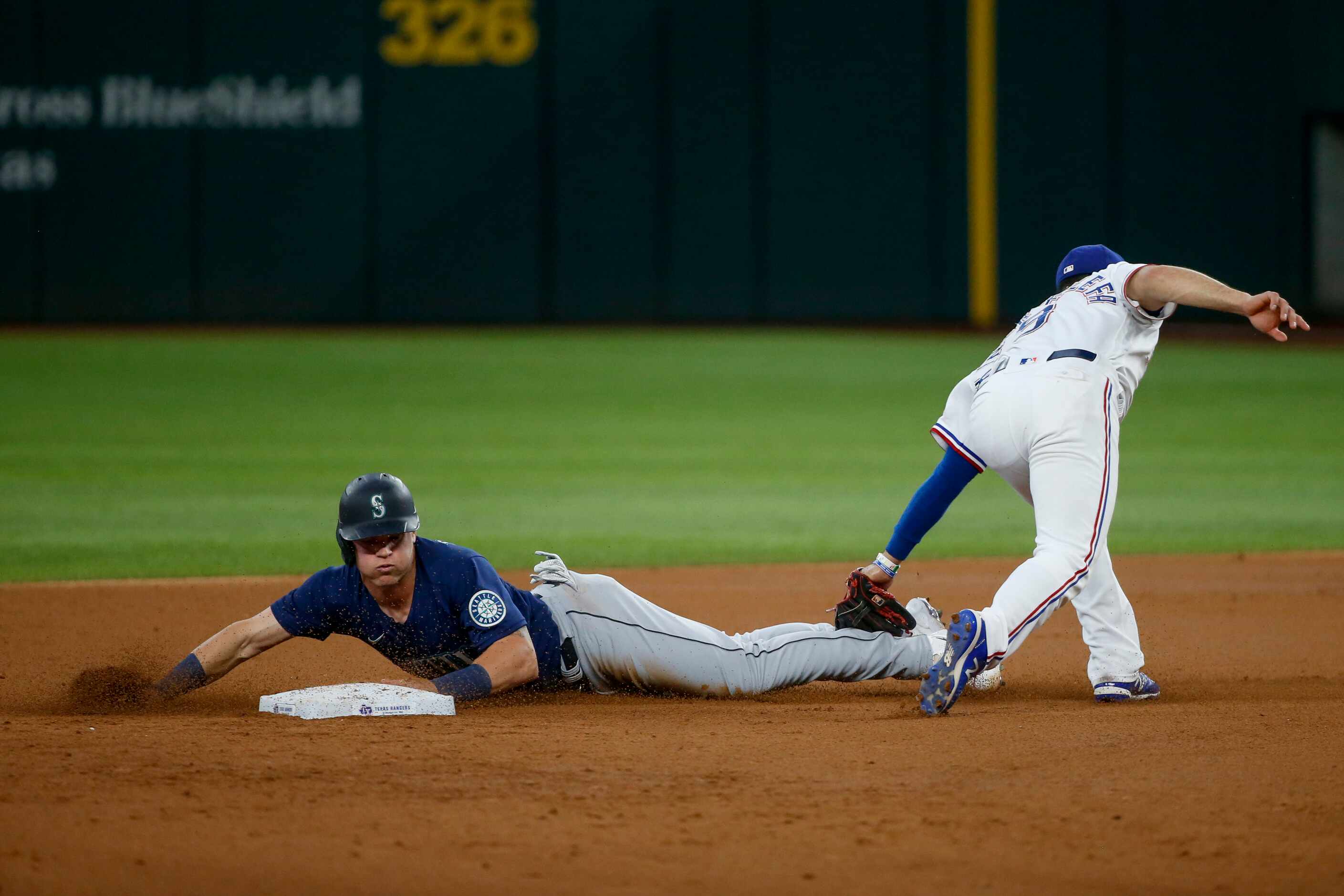 Seattle Mariners right fielder Jake Bauers (5) slides safely into second base ahead of the...
