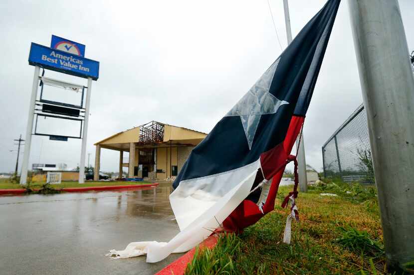 A tattered and wet Texas flag lay on the ground last Saturday outside the damaged America's...